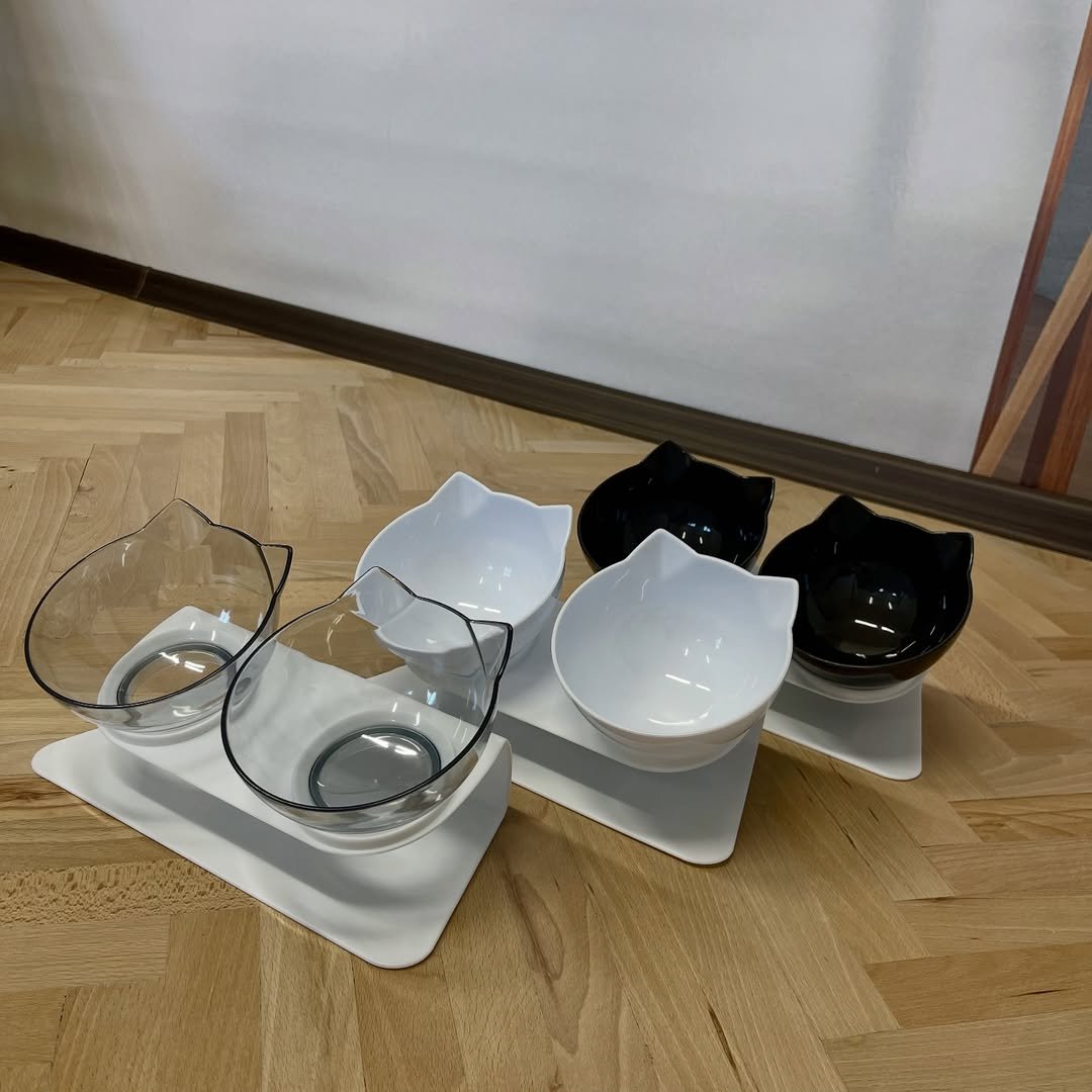 A stylish double bowl for your pets.  Made of high-strength plastic. Without extraneous odors. The angle of inclination of the bowls is 15°, which allows your pet to conveniently and comfortably eat food and drink water. 😻 – Cat Home